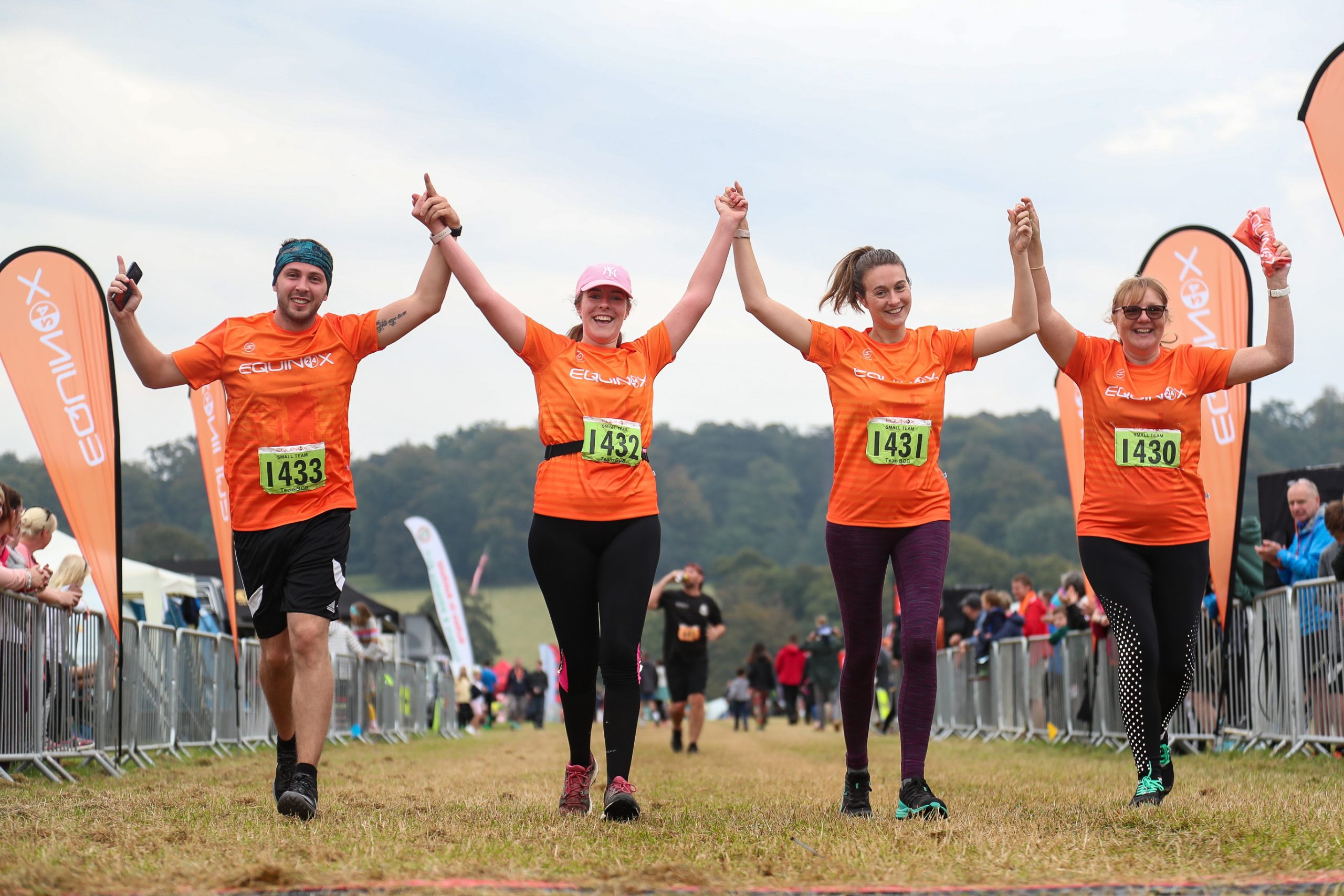 Team runners crossing line